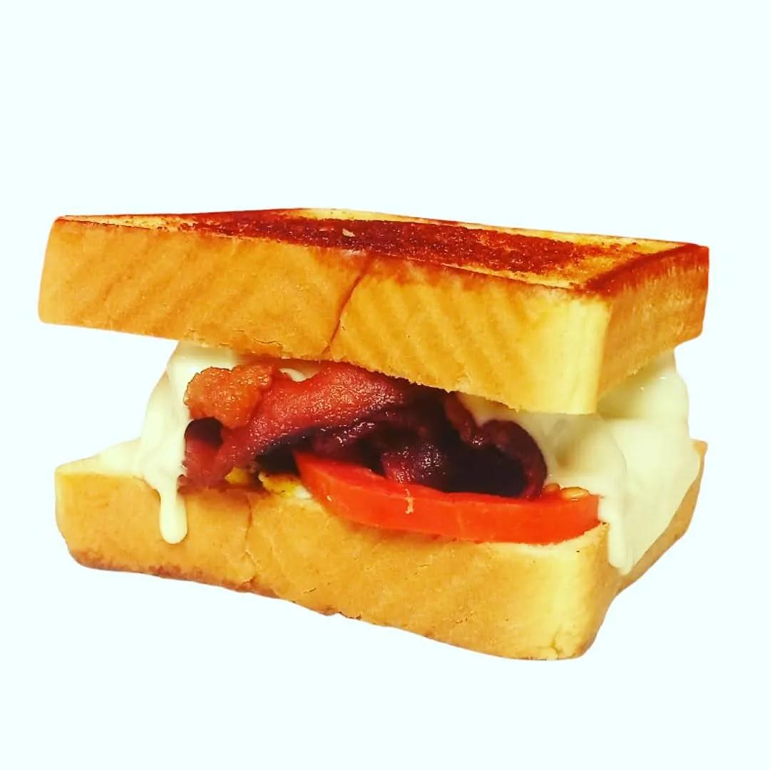 BLT grilled cheese with bacon, tomato and melted cheese on thick Texas toast