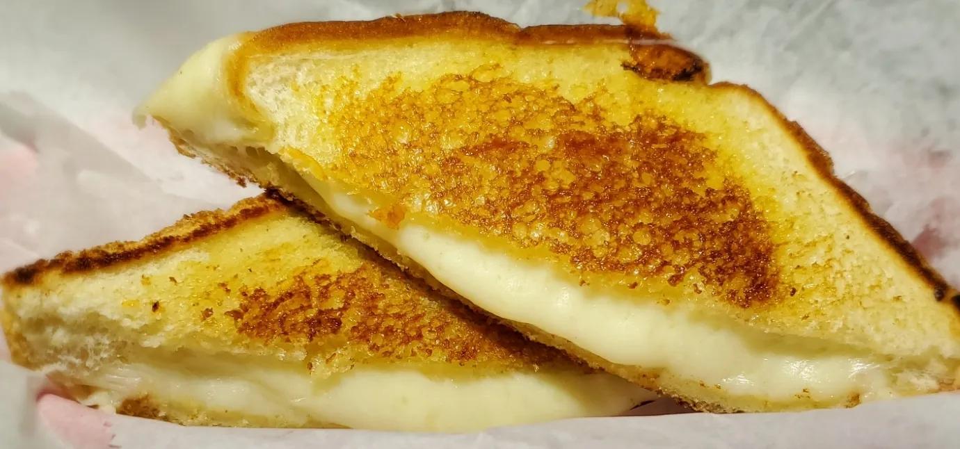 Classic grilled cheese cut into triangles, a kid favorite at school carnivals